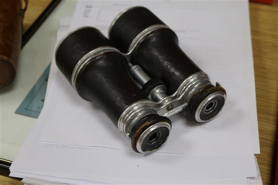 A pair of leather cased binoculars